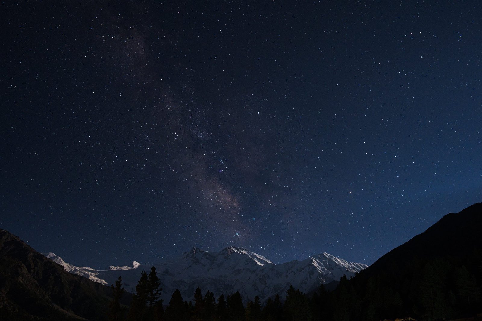 A shepherd hut below the snow face of Nanga Parbat at dusk