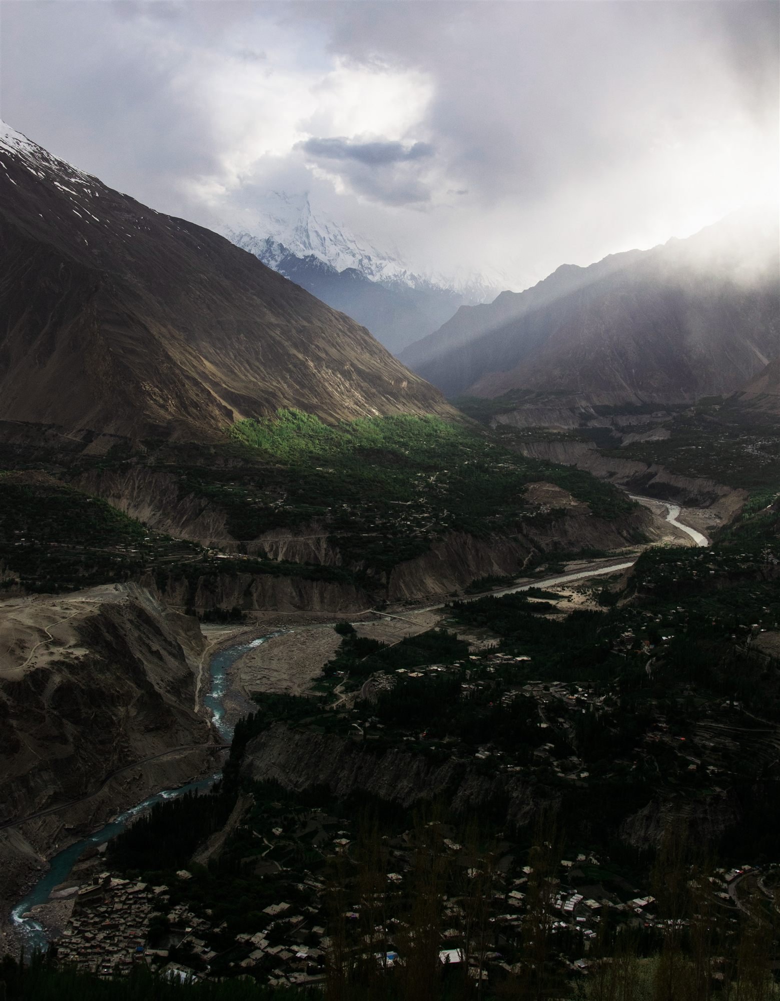 An overview of Karimabad and the Hunza River winding through the valley floor