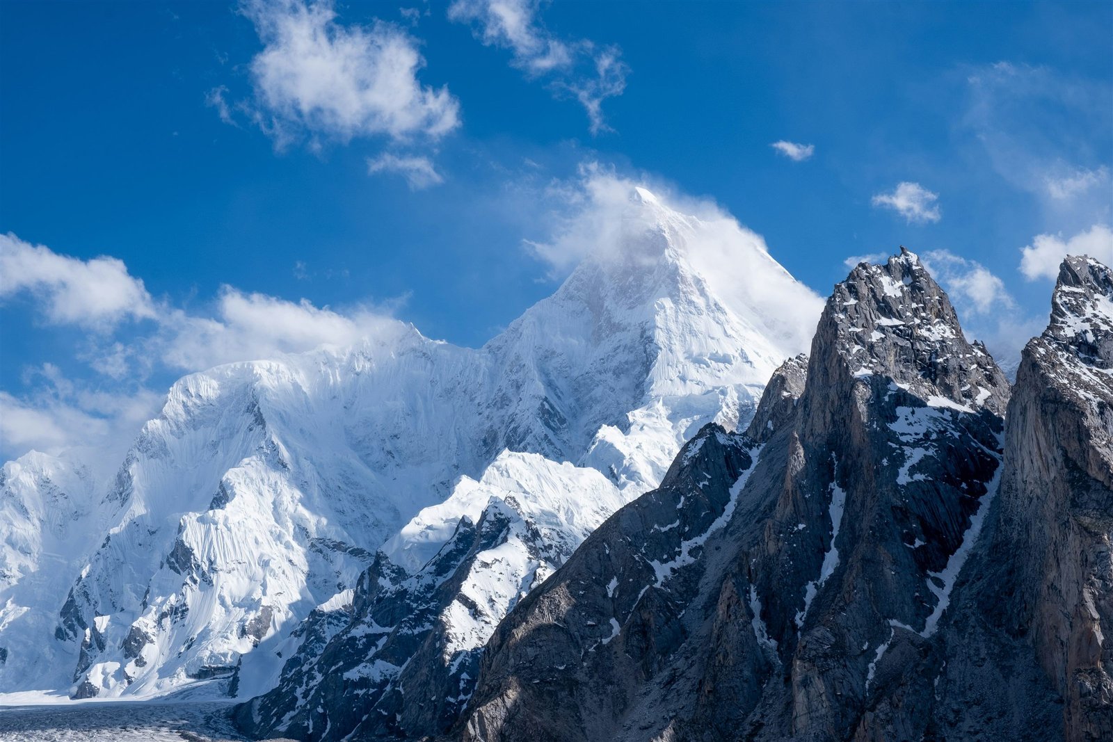 The sharp summit of Masherbrum rising above the Hushe valley