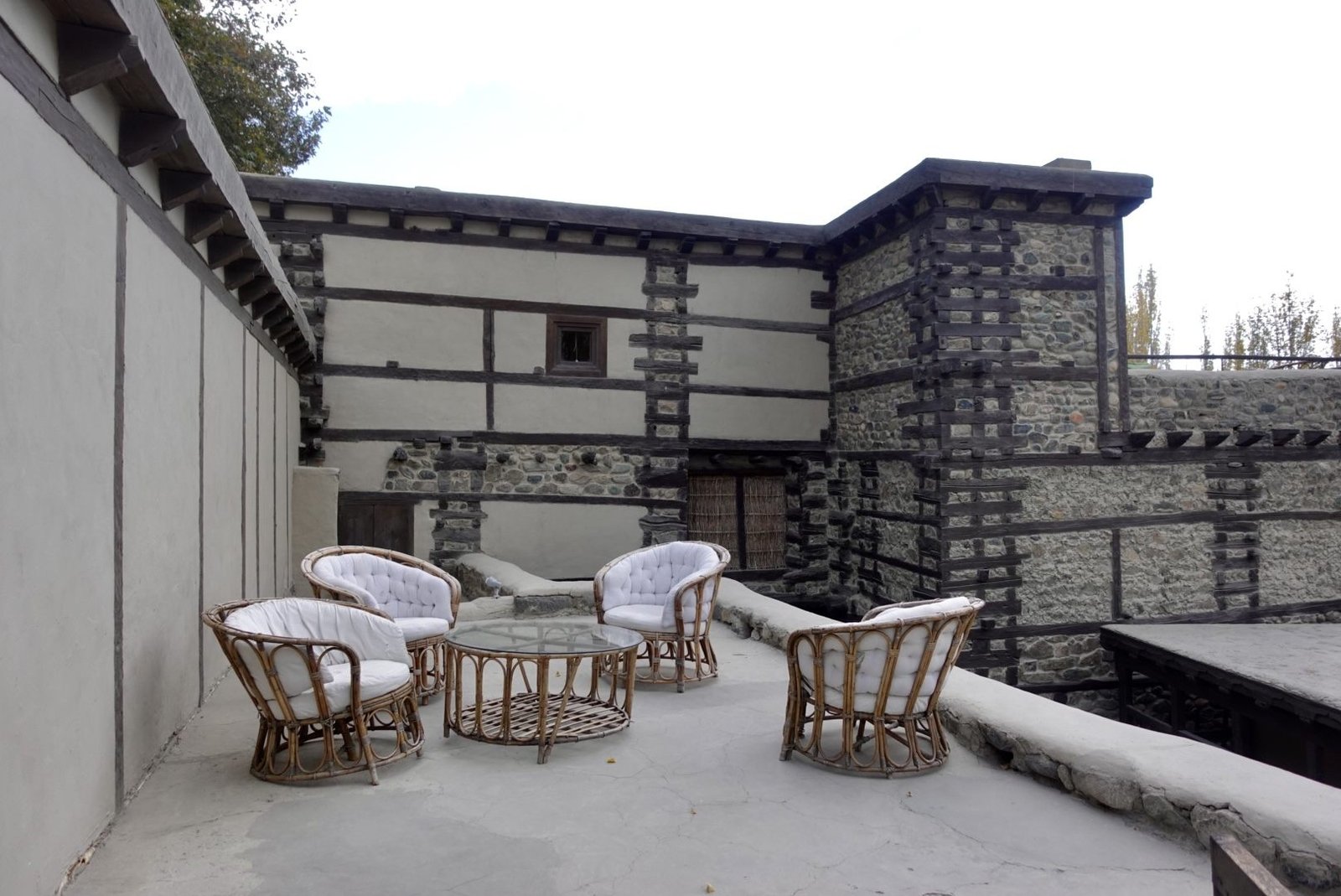 A stone stairway leading up the timber-framed walls of Shigar Fort